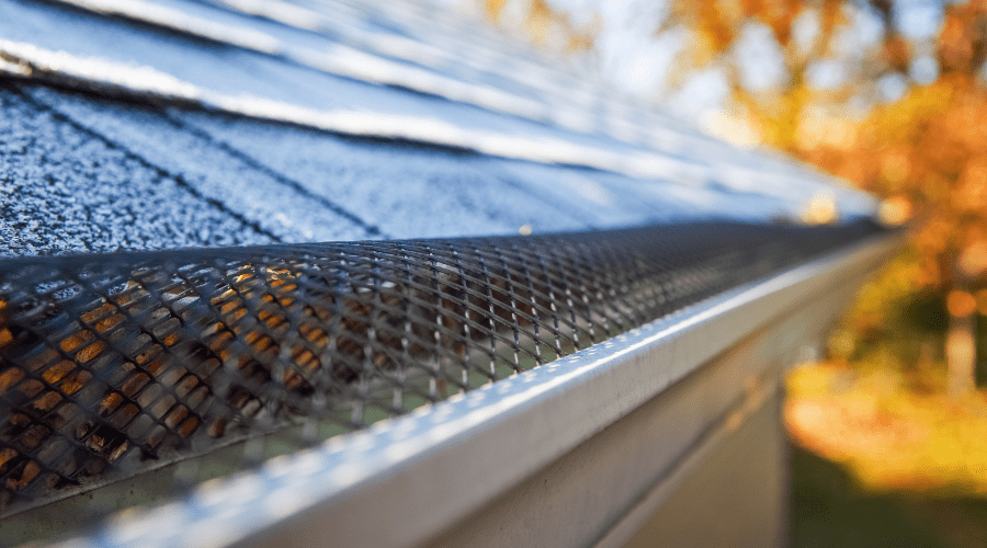 Close up view of gutter guards on an autumn day