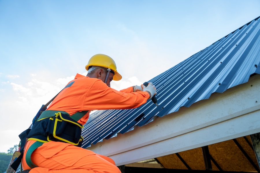 Professional technical workers working install new roof