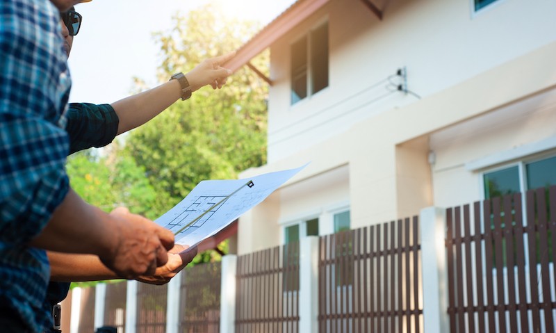 Roofing contractor assessing essential parts of a roof