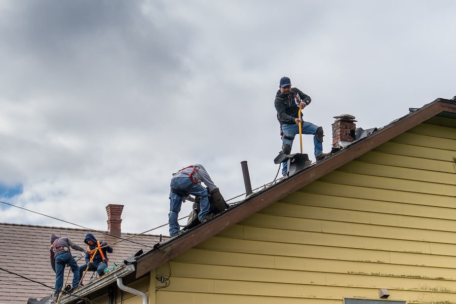 Everett WA. USA - 03-23-2021: Old Shingle Roof Being Removed