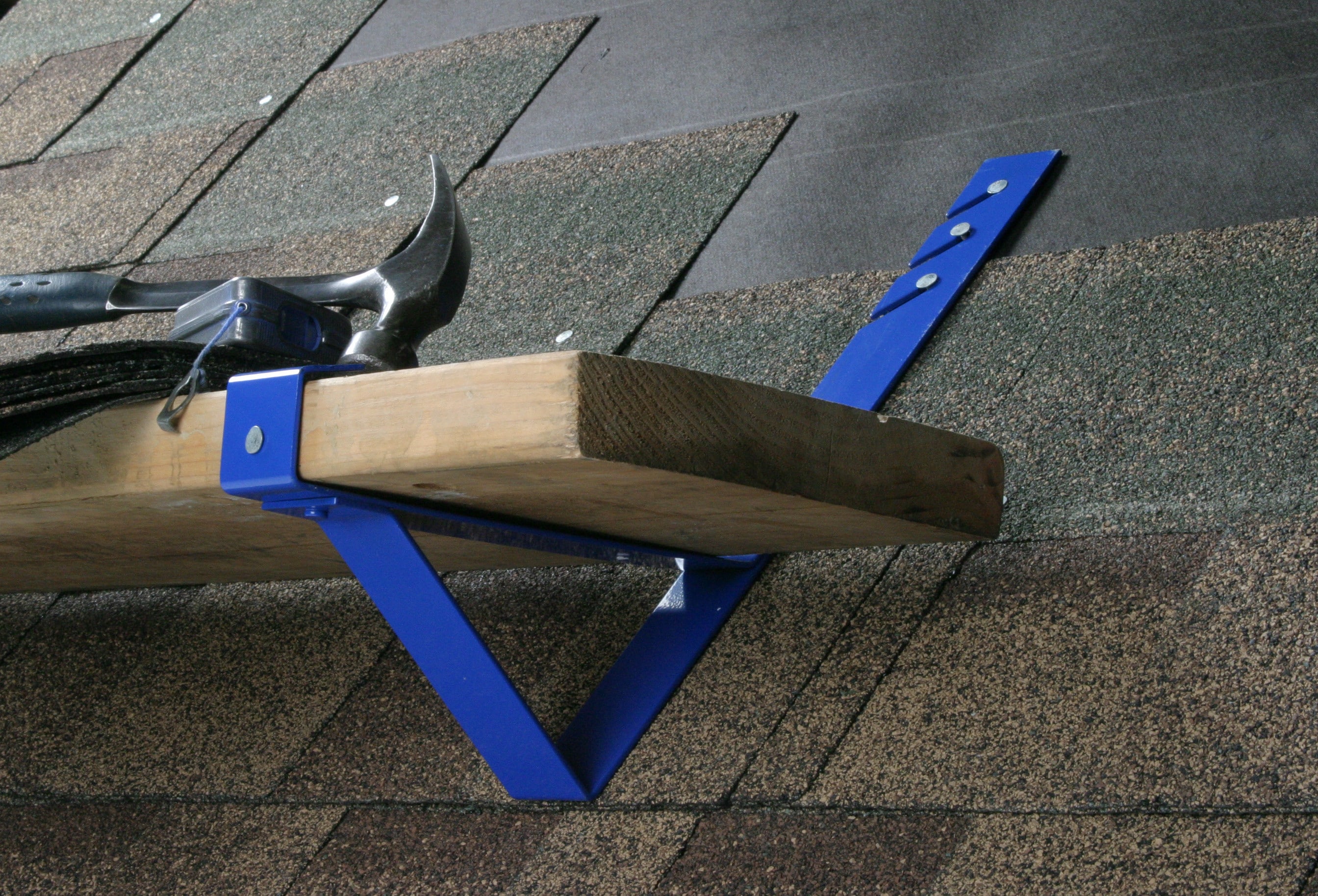 Adjustable roof jack with a plank holding tools